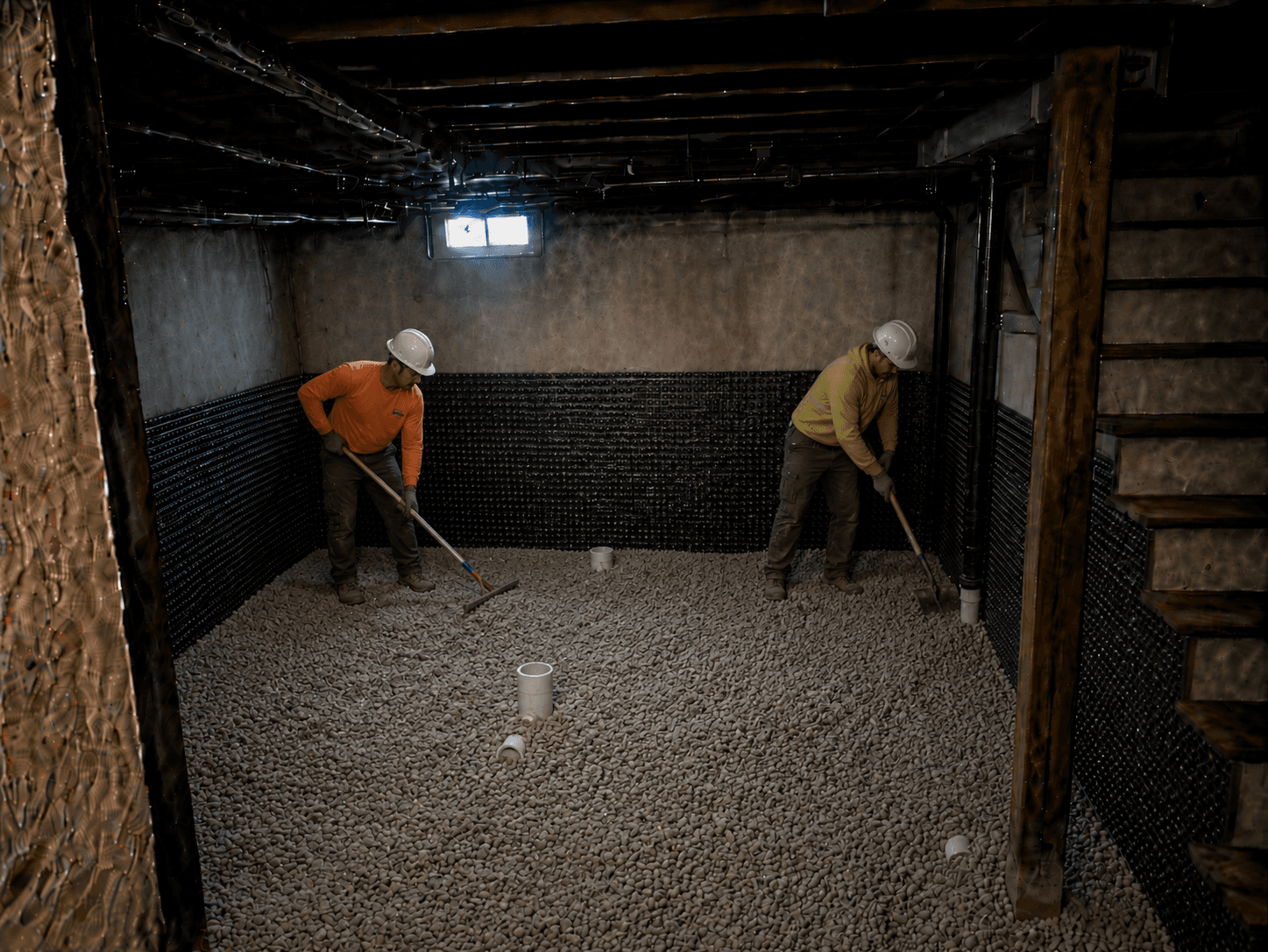 Compacted gravel base over drainage system
